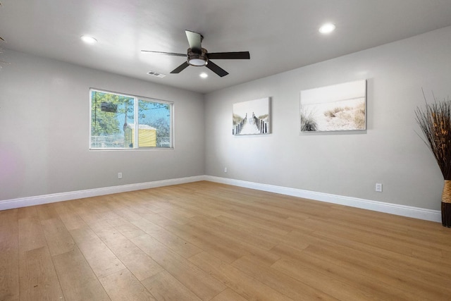 unfurnished room with ceiling fan and light wood-type flooring