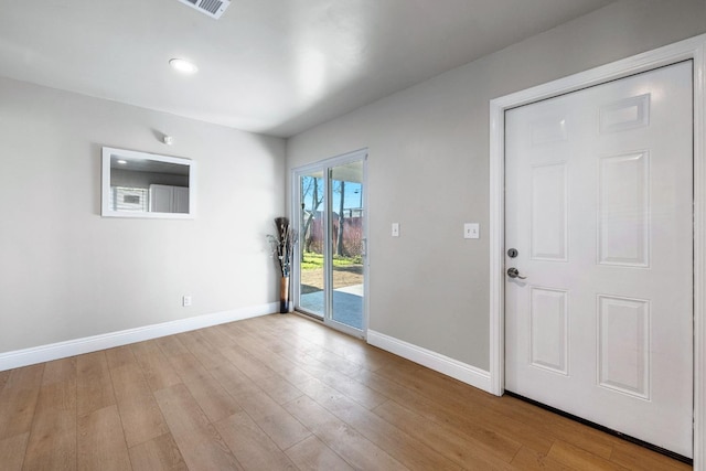 entryway with light hardwood / wood-style flooring