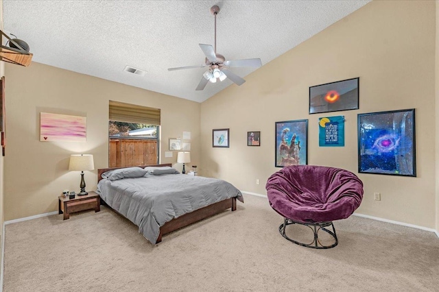 carpeted bedroom with ceiling fan, a textured ceiling, and vaulted ceiling