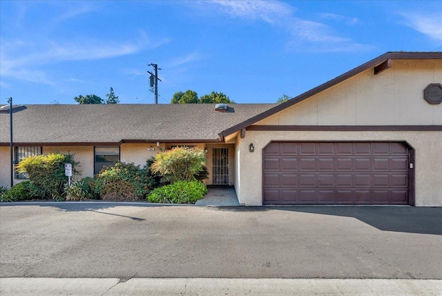 single story home with a garage