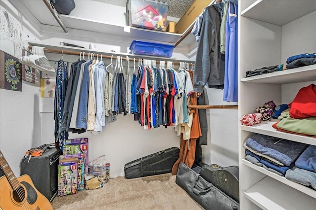 walk in closet featuring carpet floors