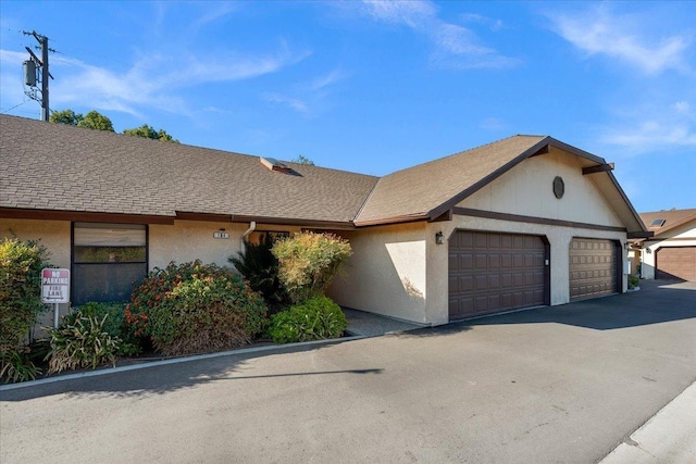 ranch-style home with a garage