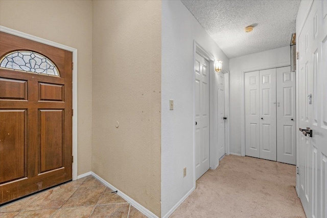 entrance foyer featuring a textured ceiling