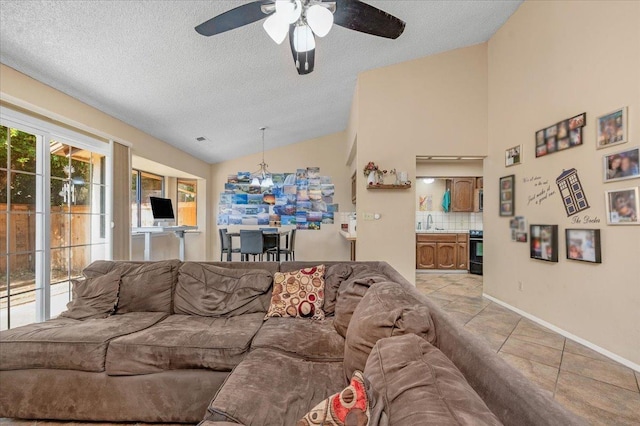 living room with ceiling fan with notable chandelier, sink, vaulted ceiling, light tile patterned floors, and a textured ceiling