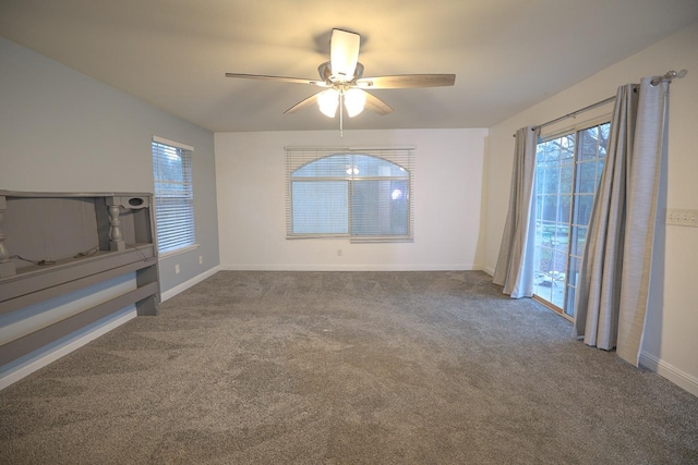 unfurnished room featuring ceiling fan and carpet floors