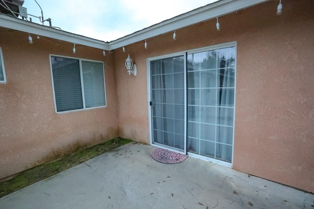 property entrance with a patio