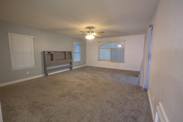 carpeted empty room with ceiling fan