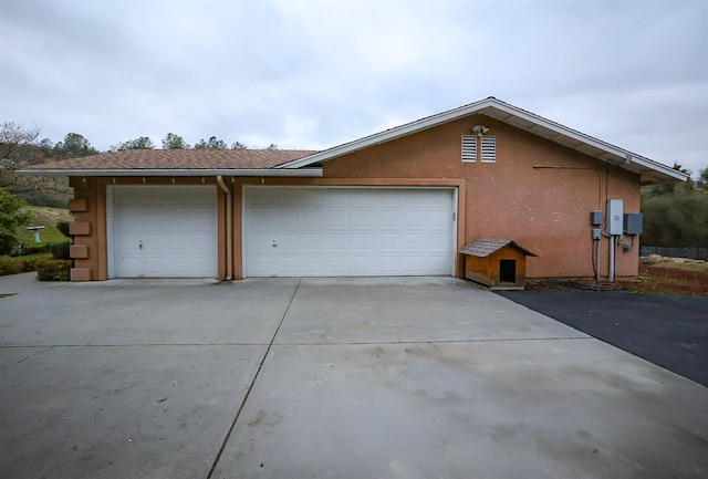 view of side of property featuring a garage