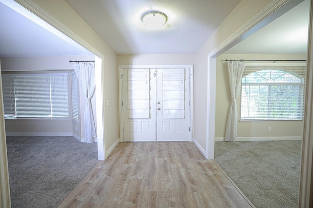 view of carpeted entrance foyer