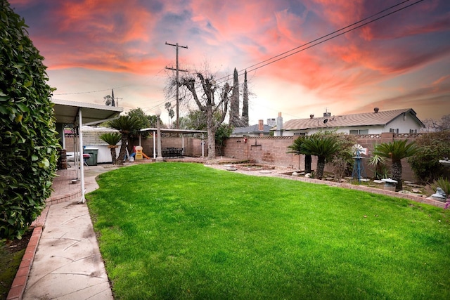 view of yard at dusk