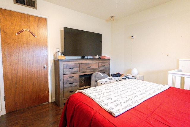 bedroom featuring dark hardwood / wood-style floors