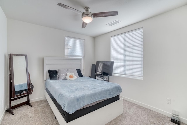 carpeted bedroom featuring ceiling fan