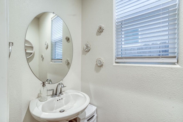 bathroom with sink and a healthy amount of sunlight