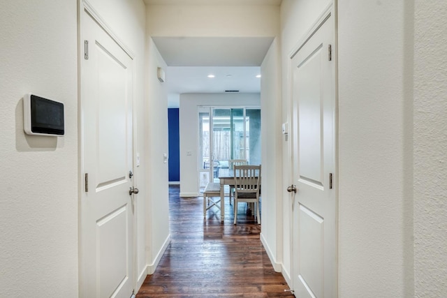 hall with dark hardwood / wood-style floors