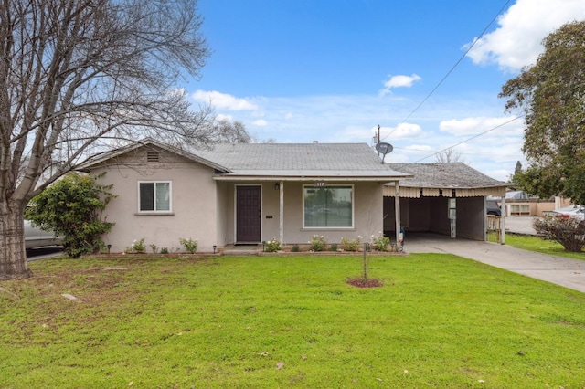 ranch-style house featuring a front yard and a carport