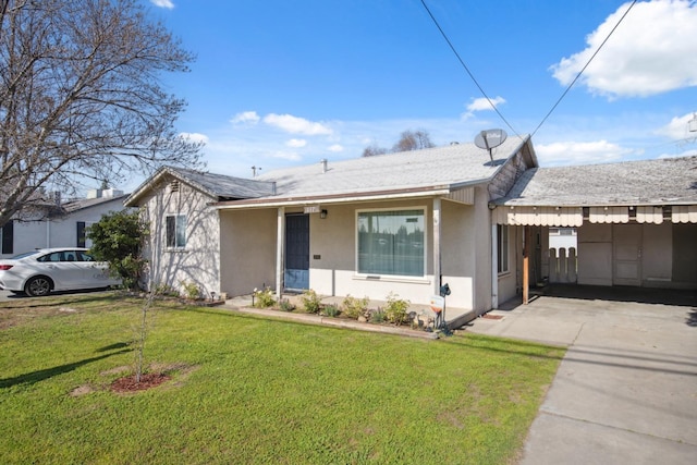 ranch-style home with a front lawn