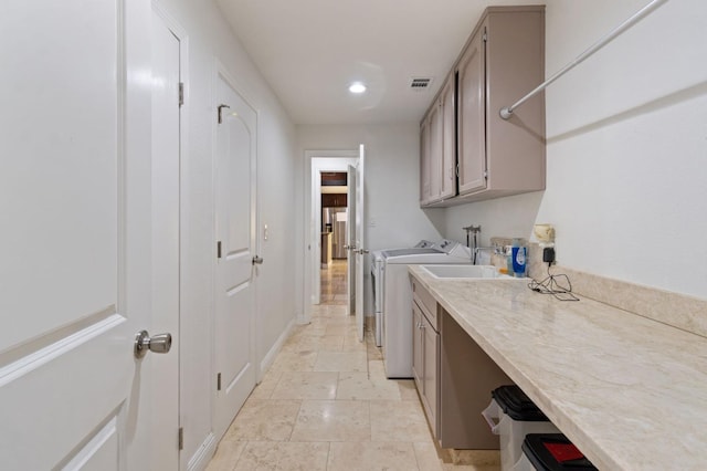 laundry room featuring recessed lighting, cabinet space, visible vents, washing machine and dryer, and baseboards