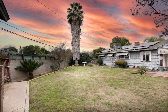 view of yard at dusk