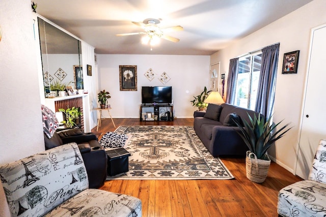 living room with hardwood / wood-style floors and ceiling fan