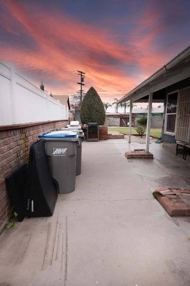 view of patio terrace at dusk