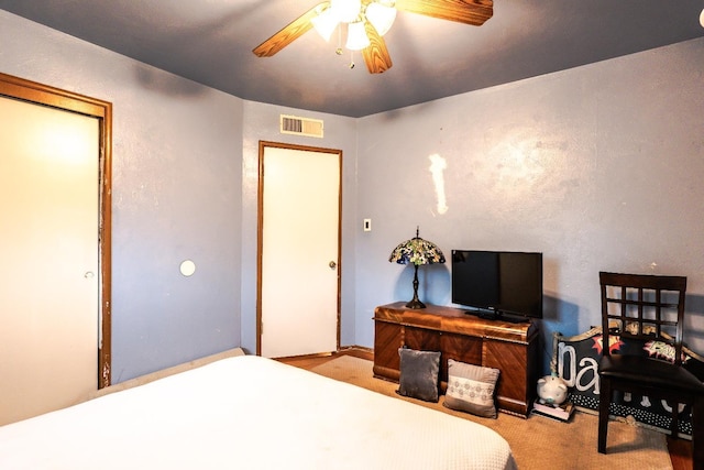 carpeted bedroom featuring ceiling fan