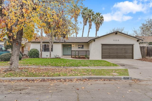 ranch-style home featuring a front yard and a garage