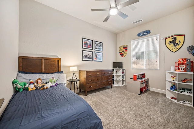 bedroom featuring ceiling fan and light carpet