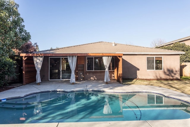 rear view of house featuring a patio