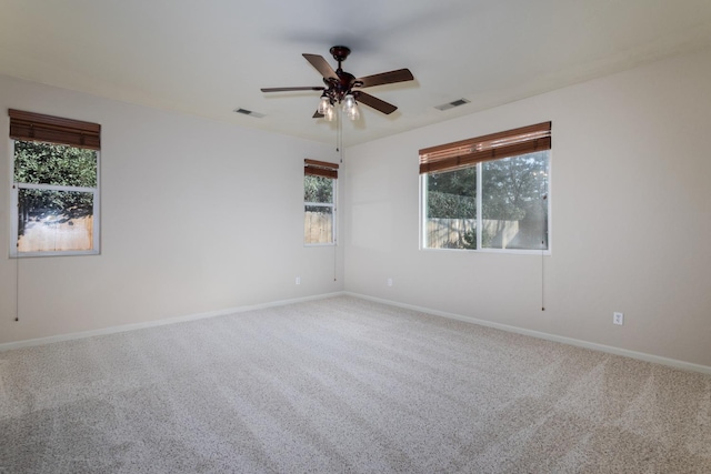 empty room featuring carpet and ceiling fan