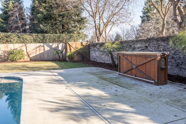 view of patio / terrace with a fenced in pool