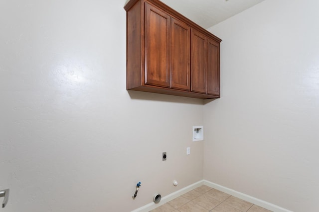 laundry room with electric dryer hookup, gas dryer hookup, cabinets, and hookup for a washing machine