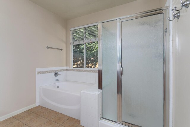 bathroom with tile patterned flooring and plus walk in shower