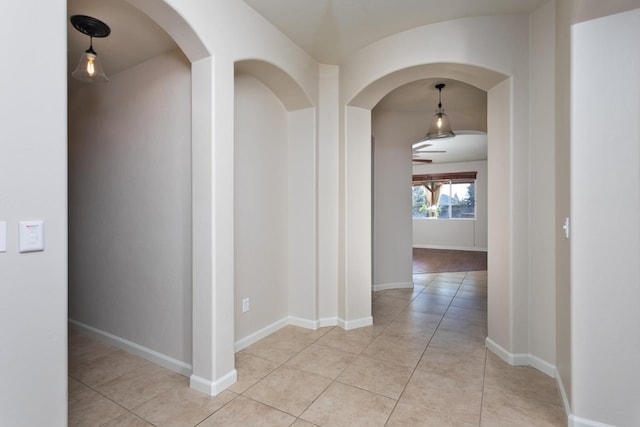 hall with light tile patterned flooring