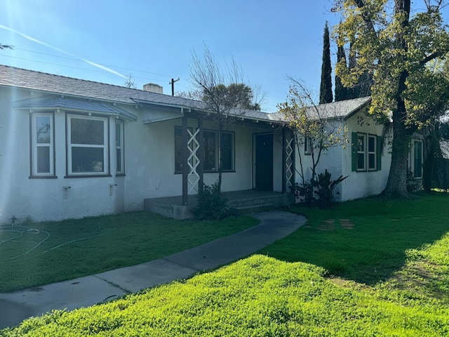 ranch-style house with a front lawn