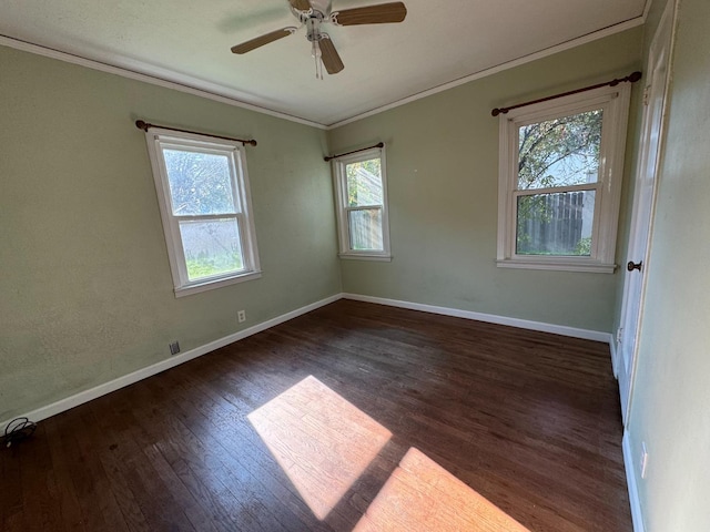 spare room featuring ceiling fan, dark hardwood / wood-style flooring, and ornamental molding