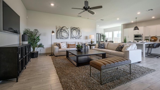 living room featuring ceiling fan