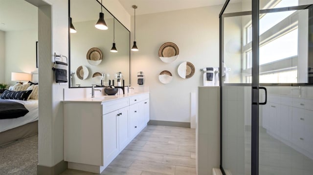 bathroom with vanity and an enclosed shower