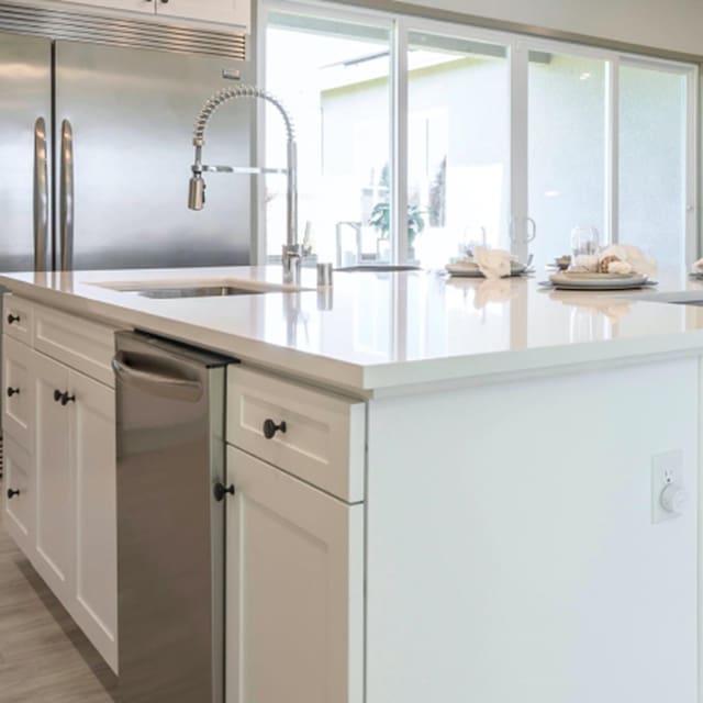 kitchen featuring dishwasher, sink, white cabinets, and light hardwood / wood-style floors