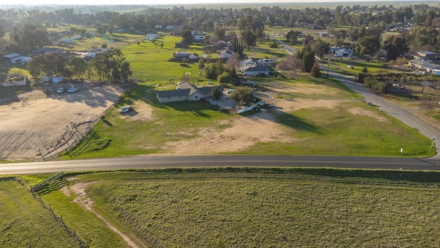 birds eye view of property with a rural view