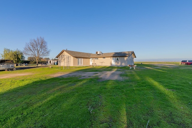 single story home featuring a front yard