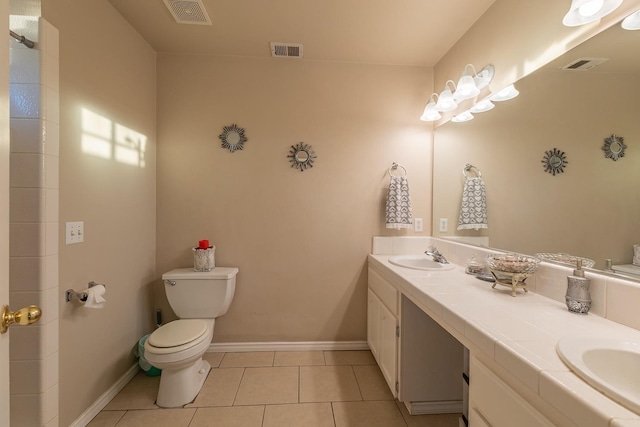 full bath featuring tile patterned flooring, visible vents, and a sink