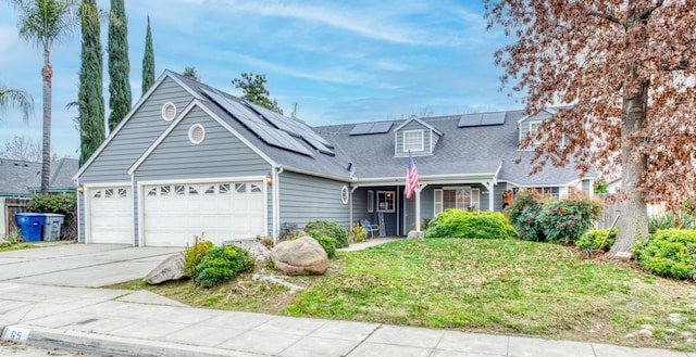 view of front of home with solar panels and a garage