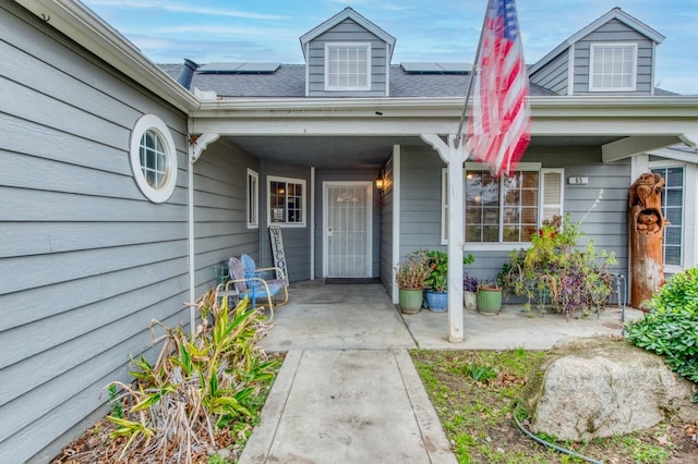 doorway to property with solar panels