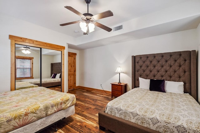 bedroom with a closet, ceiling fan, and dark wood-type flooring