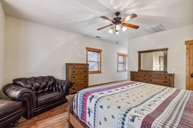 bedroom with hardwood / wood-style flooring and ceiling fan