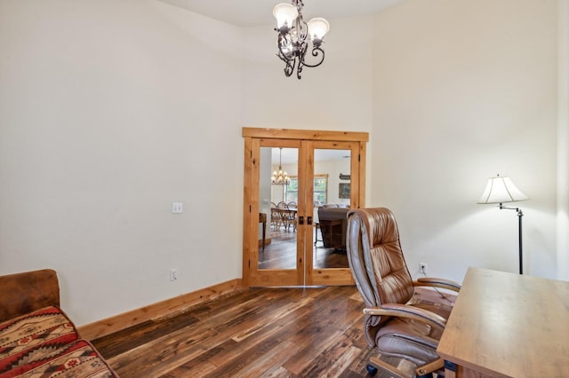 office space with french doors, dark hardwood / wood-style floors, and a notable chandelier