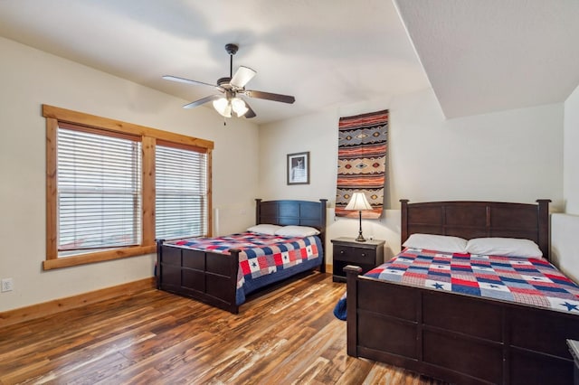 bedroom with hardwood / wood-style flooring and ceiling fan