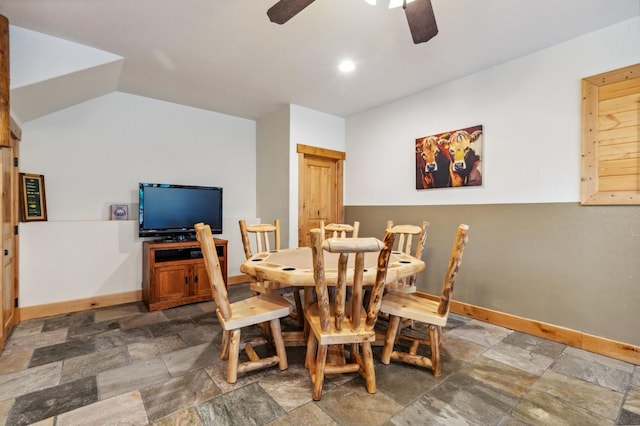 dining space with vaulted ceiling and ceiling fan