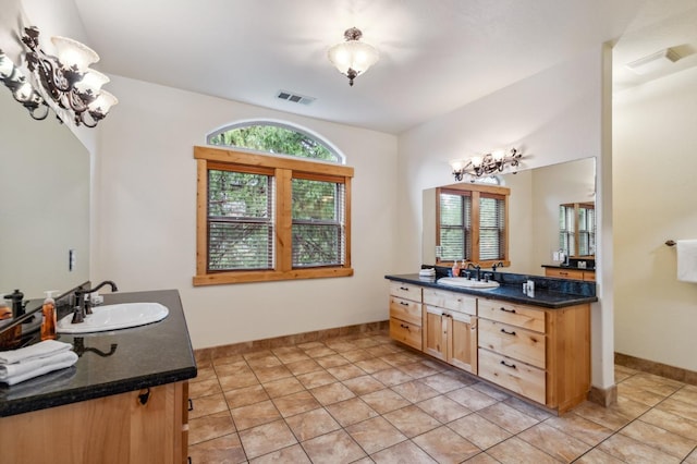 bathroom with tile patterned flooring and vanity