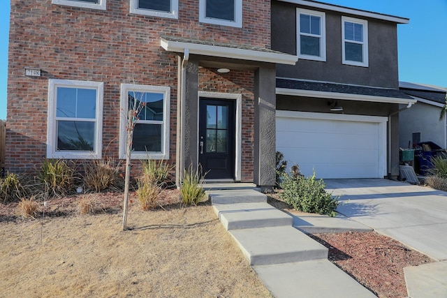 view of front of property with a garage